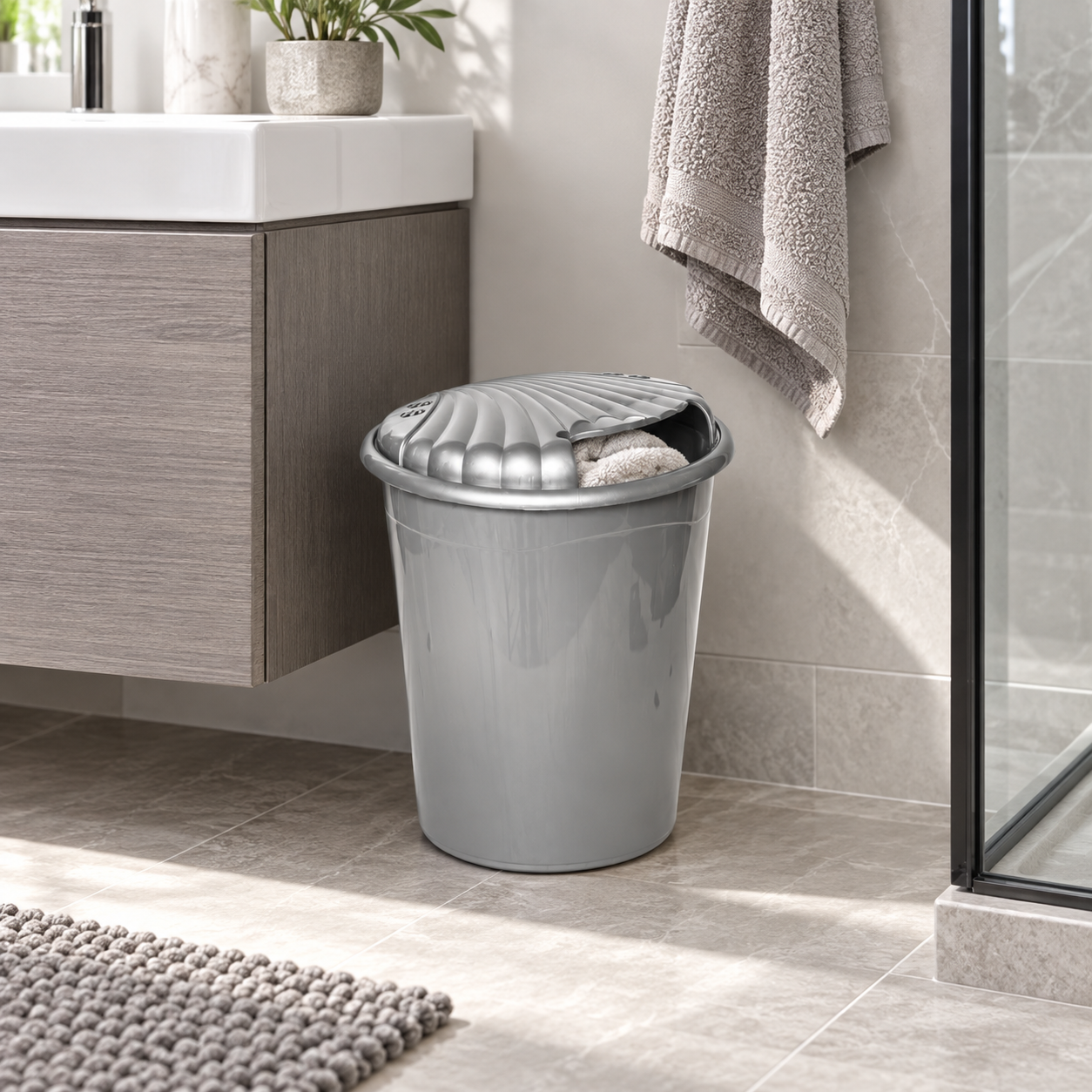 MINI LAUNDRY BIN used in a compact modern bathroom