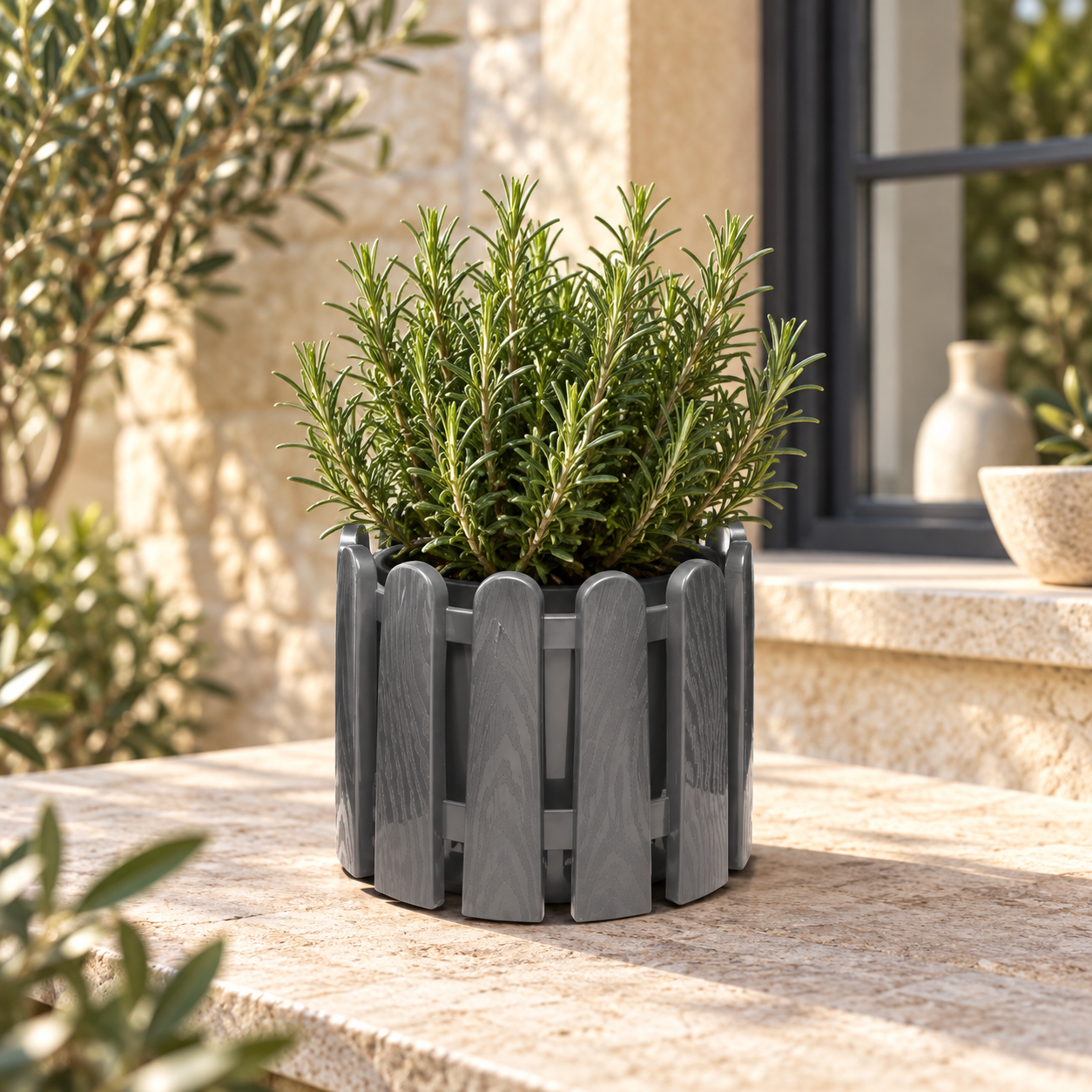B209 Decor 2 grey picket-style planter with rosemary on a European terrace