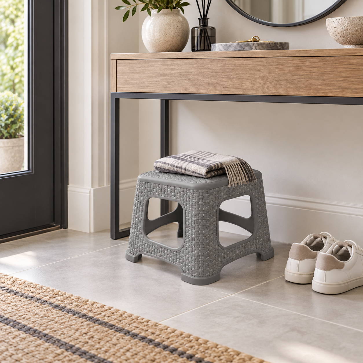 RATAN 1 compact stool in a modern entryway