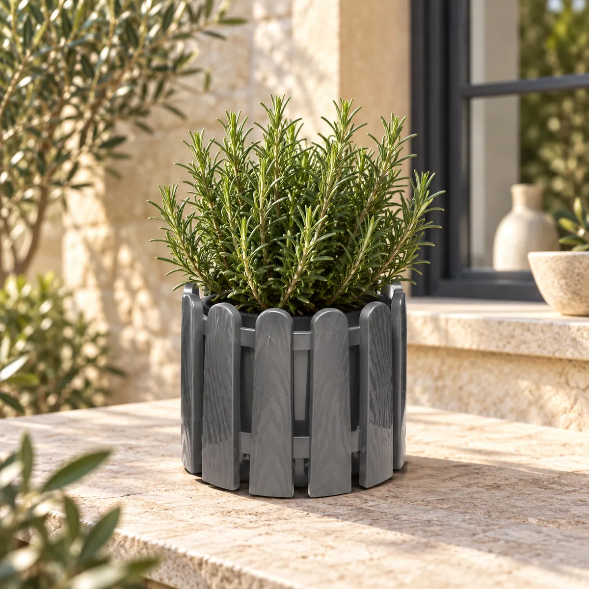 B209 Decor 2 grey picket-style planter with rosemary on a European terrace